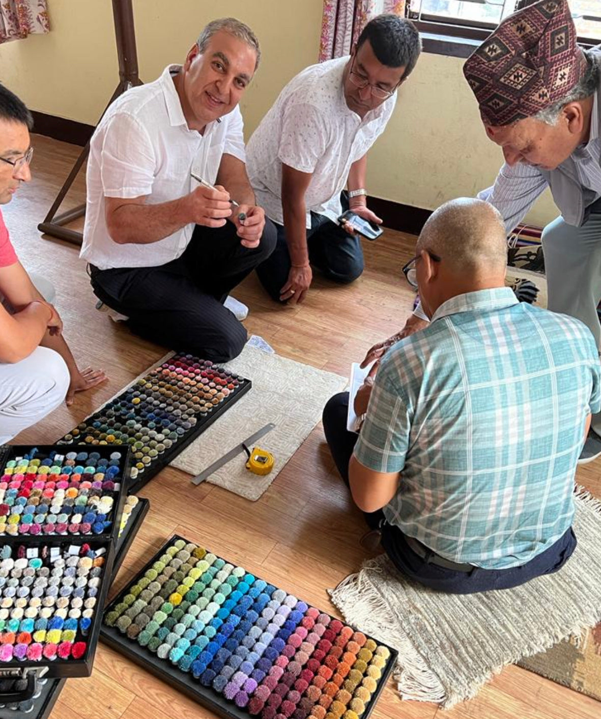 owner picking colors for rugs