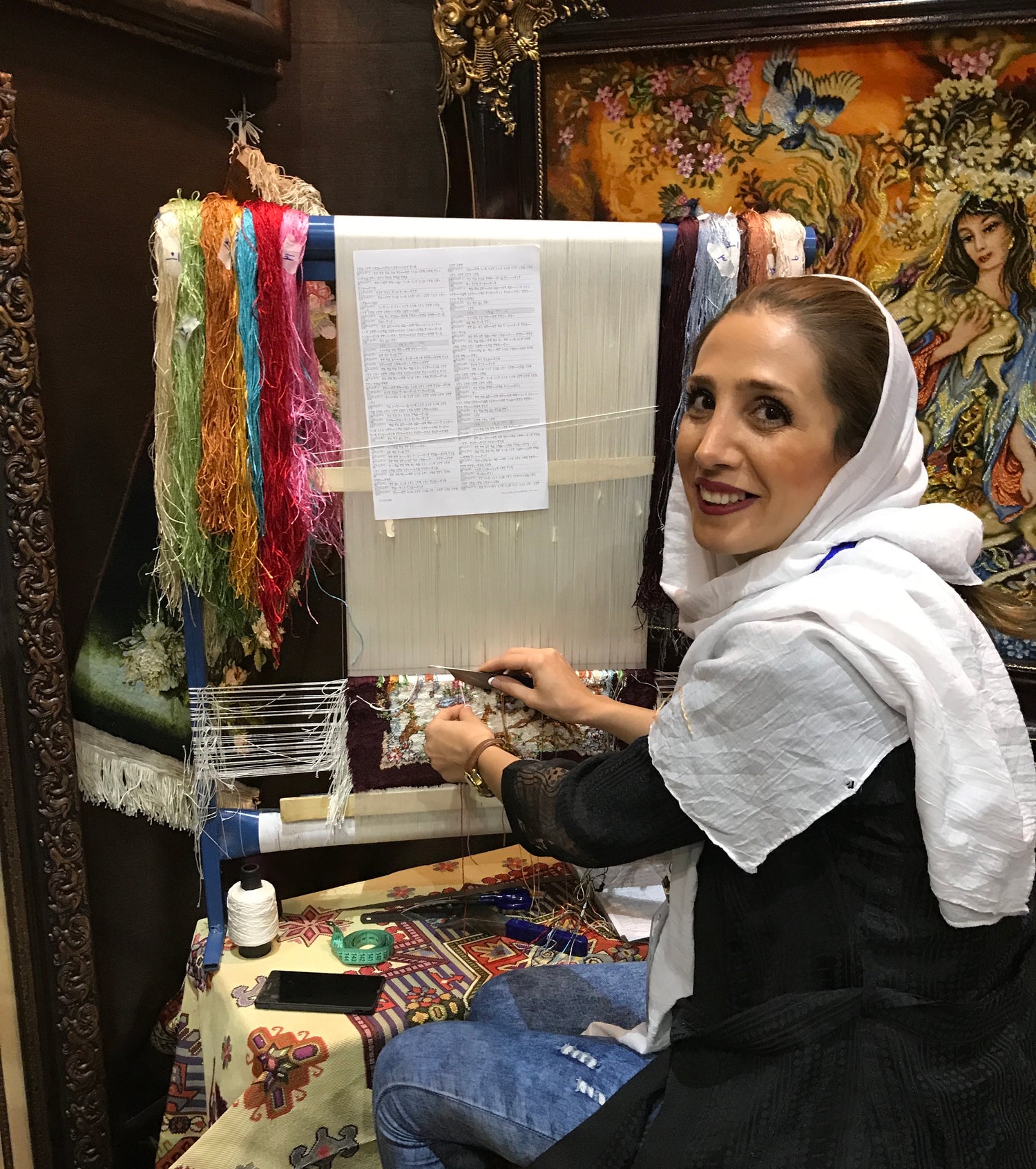 lady making a tapestry